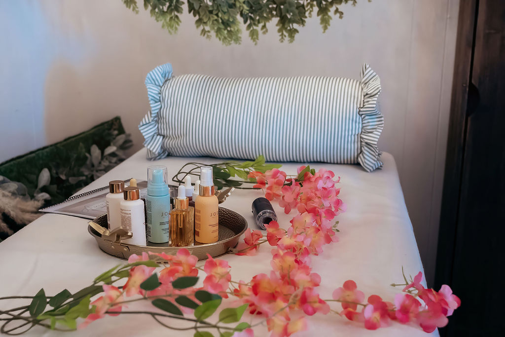 Curated head spa product tray with serums, mists and oils on a styled treatment bed at A Shade of Vintage